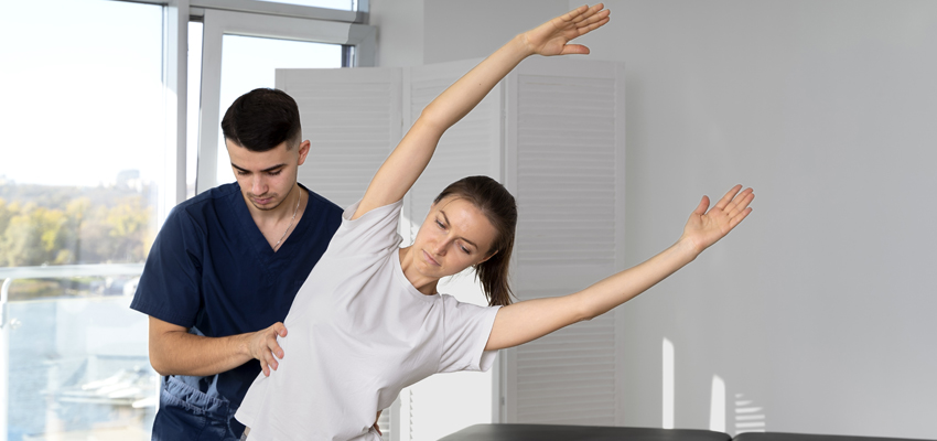 physio performing workcover rehabilitation with female patient